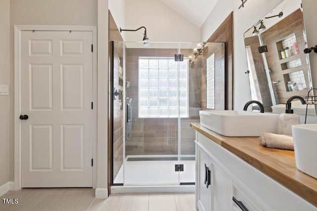 6425 Cross Ridge Dr, Holly Springs, NC 27540 - full bathroom featuring a shower stall, vanity, and vaulted ceiling