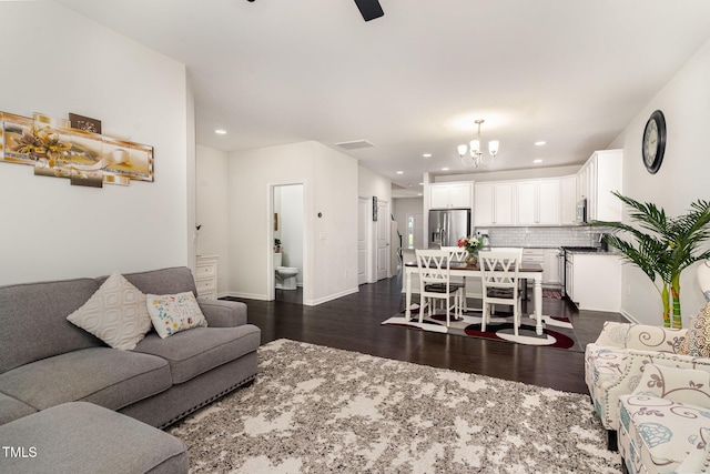 155 Writing Rock Pl, Apex, NC 27539 - living room featuring a chandelier, dark wood-style flooring, recessed lighting, and a ceiling fan