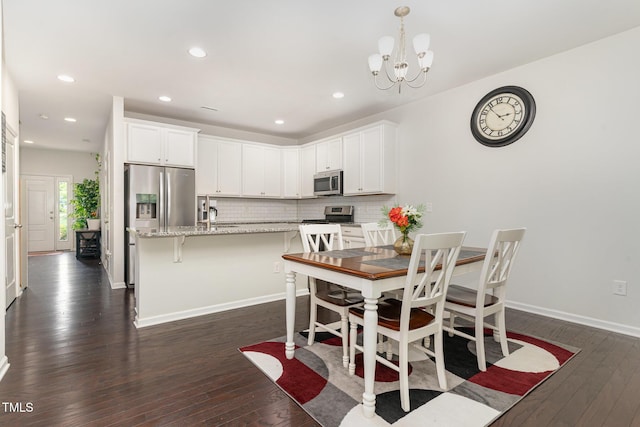 155 Writing Rock Pl, Apex, NC 27539 - dining area featuring dark wood-style flooring, a chandelier, and recessed lighting