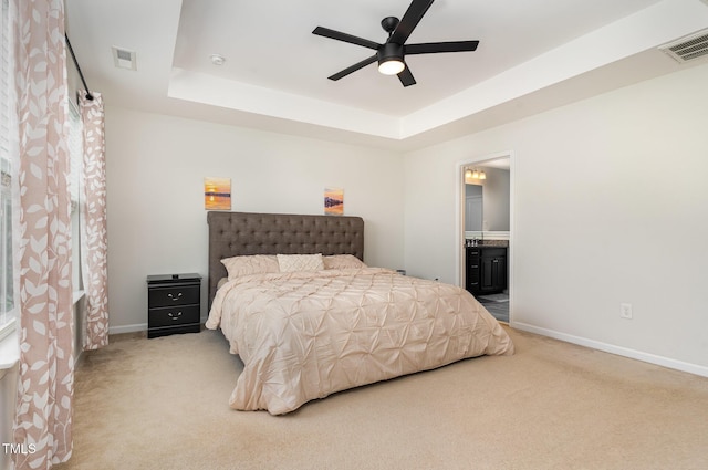 155 Writing Rock Pl, Apex, NC 27539 - bedroom with carpet floors, a tray ceiling, ensuite bathroom, and ceiling fan