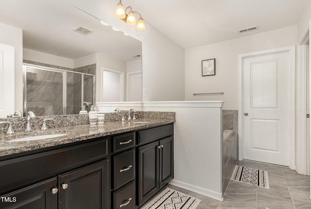 155 Writing Rock Pl, Apex, NC 27539 - bathroom with double vanity, a garden tub, and a shower stall
