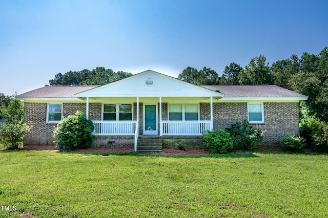 5840 Rocking Chair Dr, Youngsville, NC 27596 - single story home with brick siding, a front yard, and covered porch
