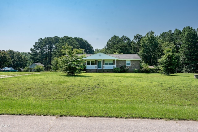 5840 Rocking Chair Dr, Youngsville, NC 27596 - ranch-style home with a front yard