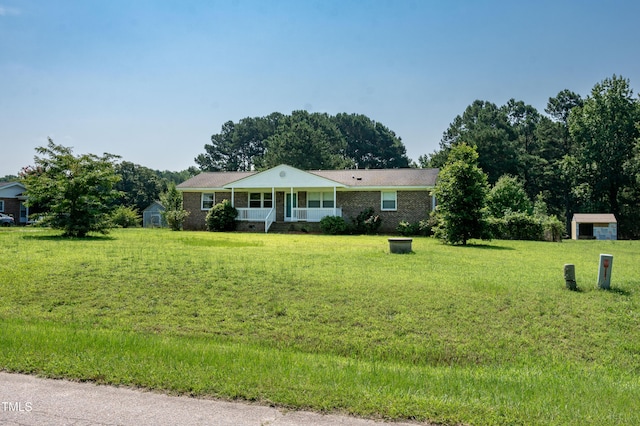5840 Rocking Chair Dr, Youngsville, NC 27596 - single story home with a shed and a front lawn