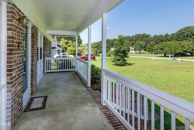 5840 Rocking Chair Dr, Youngsville, NC 27596 - porch featuring a yard
