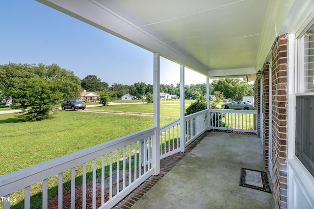 5840 Rocking Chair Dr, Youngsville, NC 27596 - porch featuring a yard