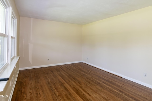 5840 Rocking Chair Dr, Youngsville, NC 27596 - empty room featuring dark wood finished floors and baseboards