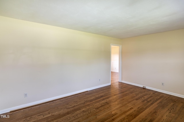 5840 Rocking Chair Dr, Youngsville, NC 27596 - empty room with baseboards and dark wood-type flooring