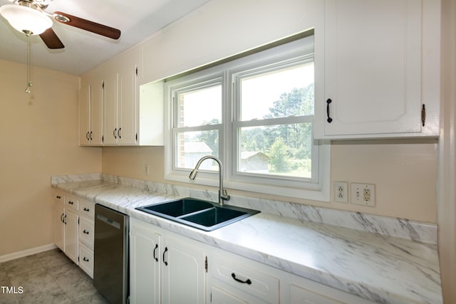 5840 Rocking Chair Dr, Youngsville, NC 27596 - kitchen featuring stainless steel dishwasher, healthy amount of natural light, white cabinetry, and ceiling fan