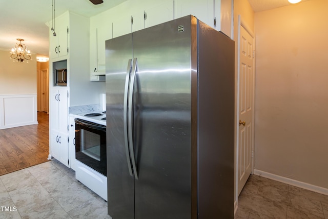5840 Rocking Chair Dr, Youngsville, NC 27596 - kitchen featuring freestanding refrigerator, white range with electric cooktop, light countertops, a chandelier, and white cabinets