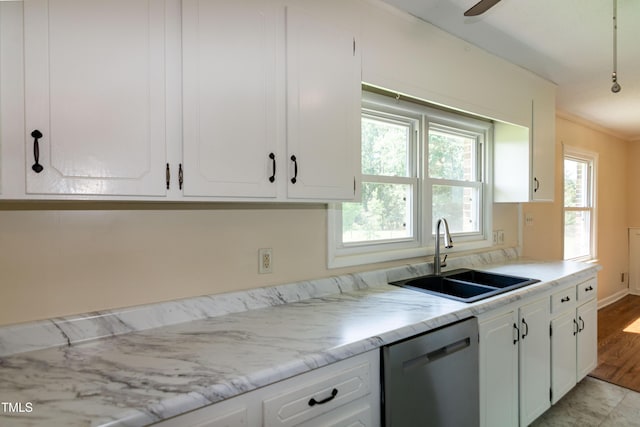 5840 Rocking Chair Dr, Youngsville, NC 27596 - kitchen featuring dishwasher, white cabinetry, and light stone countertops