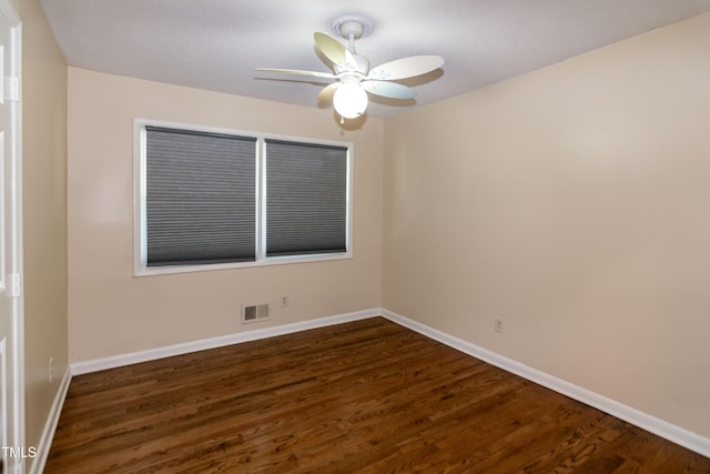 5840 Rocking Chair Dr, Youngsville, NC 27596 - empty room with dark wood-style floors and a ceiling fan