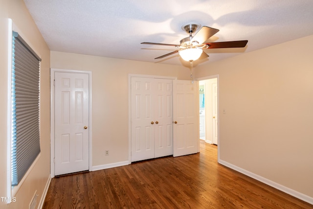 5840 Rocking Chair Dr, Youngsville, NC 27596 - unfurnished bedroom with wood finished floors, ceiling fan, and a closet