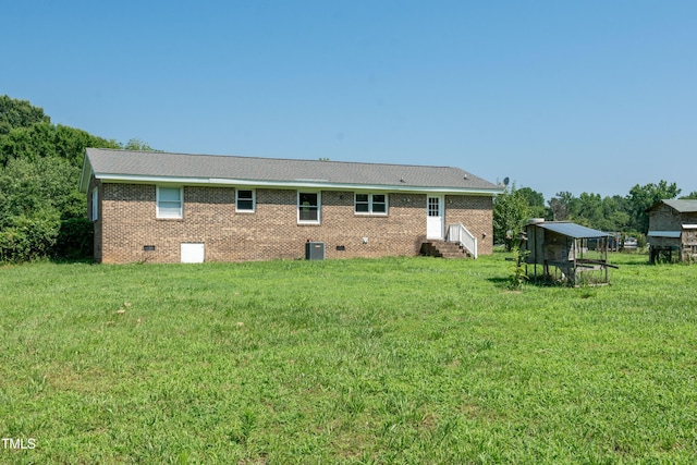 5840 Rocking Chair Dr, Youngsville, NC 27596 - rear view of property with entry steps, crawl space, a lawn, and brick siding