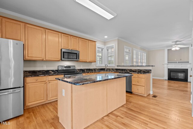1806 White Dogwood Rd, Apex, NC 27502 - kitchen with stainless steel appliances, ornamental molding, light brown cabinets, light wood-type flooring, and ceiling fan