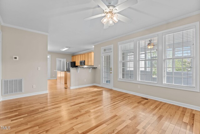 1806 White Dogwood Rd, Apex, NC 27502 - unfurnished living room with light wood-style flooring, ornamental molding, and ceiling fan