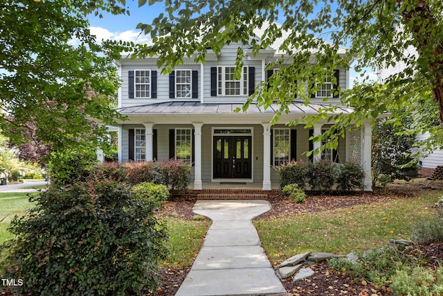 1806 White Dogwood Rd, Apex, NC 27502 - view of front of property with a standing seam roof, a porch, and a metal roof