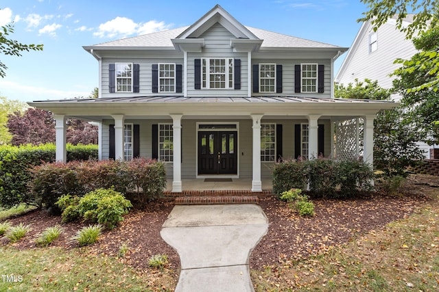 1806 White Dogwood Rd, Apex, NC 27502 - view of front of property with a standing seam roof, covered porch, a metal roof, and a shingled roof