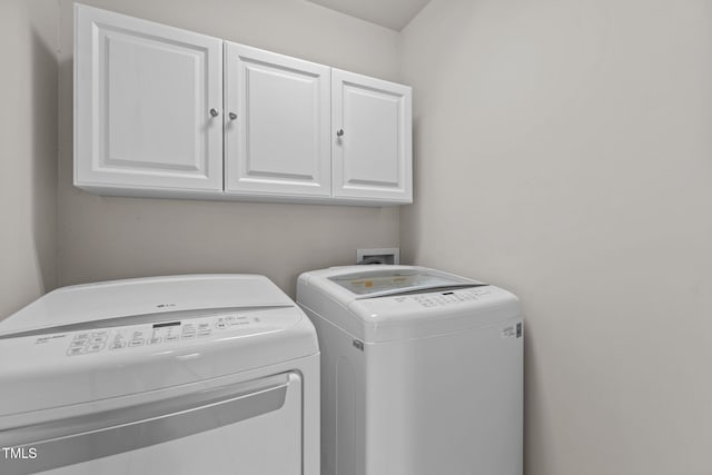 1806 White Dogwood Rd, Apex, NC 27502 - laundry room with cabinet space and washer and dryer
