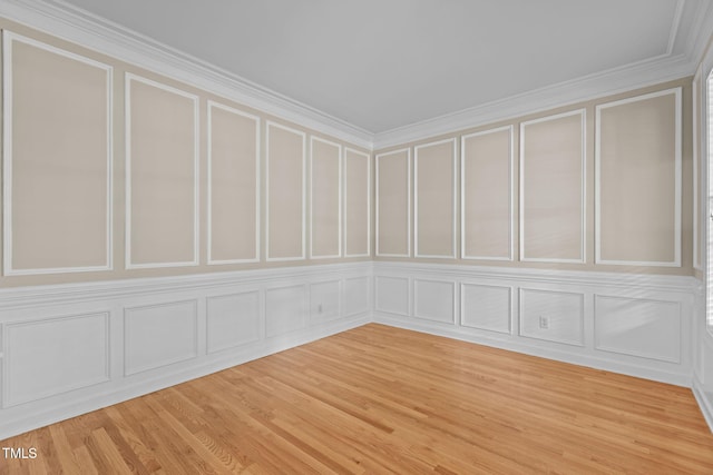 1806 White Dogwood Rd, Apex, NC 27502 - unfurnished room featuring a decorative wall, light wood-style floors, and crown molding