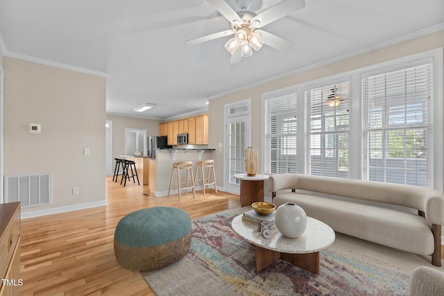 1806 White Dogwood Rd, Apex, NC 27502 - living area featuring light wood-style floors, crown molding, and a ceiling fan
