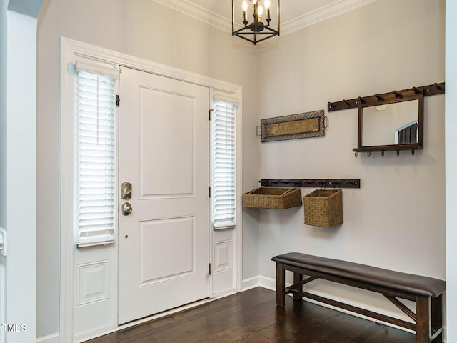 1004 Dogwood Bloom Ln, Knightdale, NC 27545 - foyer entrance with a chandelier, ornamental molding, dark wood finished floors, and arched walkways