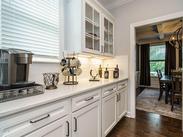 1004 Dogwood Bloom Ln, Knightdale, NC 27545 - bar area featuring ornamental molding, dark wood-style floors, and tasteful backsplash