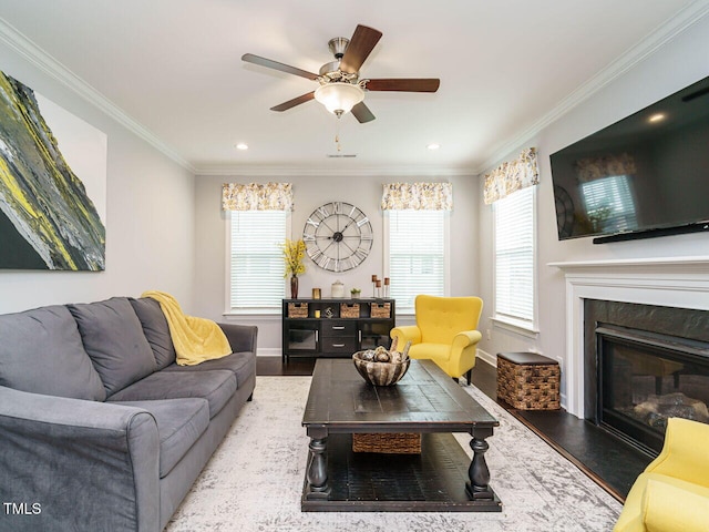 1004 Dogwood Bloom Ln, Knightdale, NC 27545 - living area featuring wood finished floors, ornamental molding, a ceiling fan, a high end fireplace, and recessed lighting