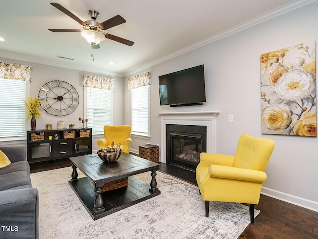 1004 Dogwood Bloom Ln, Knightdale, NC 27545 - living area featuring crown molding, wood finished floors, ceiling fan, a fireplace with flush hearth, and recessed lighting
