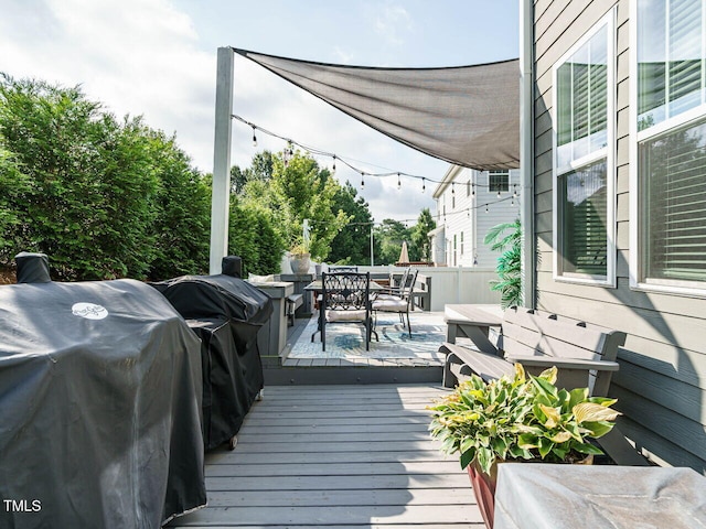 1004 Dogwood Bloom Ln, Knightdale, NC 27545 - wooden terrace featuring outdoor dining space and area for grilling