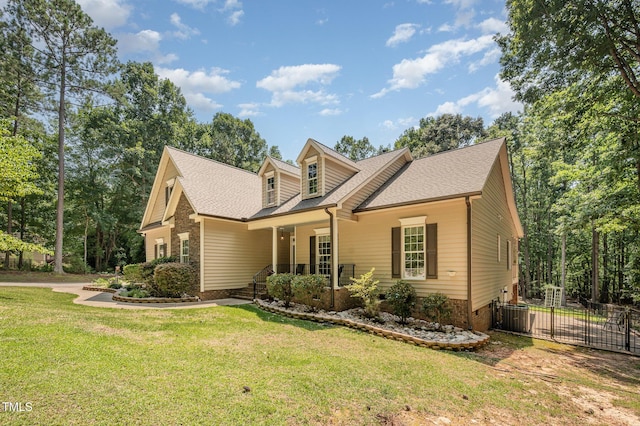1513 Anterra Dr, Wake Forest, NC 27587 - cape cod home with a shingled roof and a porch
