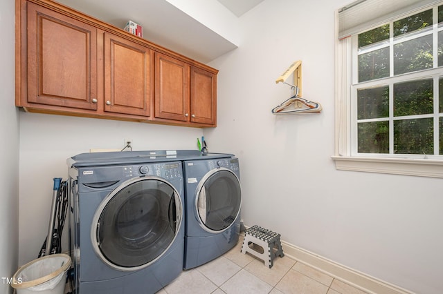 1513 Anterra Dr, Wake Forest, NC 27587 - washroom with cabinet space, washer and dryer, and light tile patterned floors