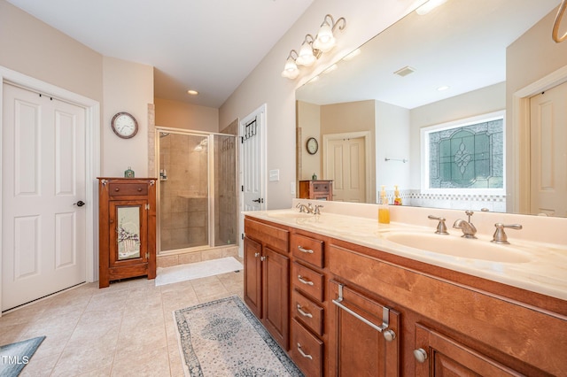 1513 Anterra Dr, Wake Forest, NC 27587 - bathroom featuring tile patterned floors, a shower stall, double vanity, and recessed lighting