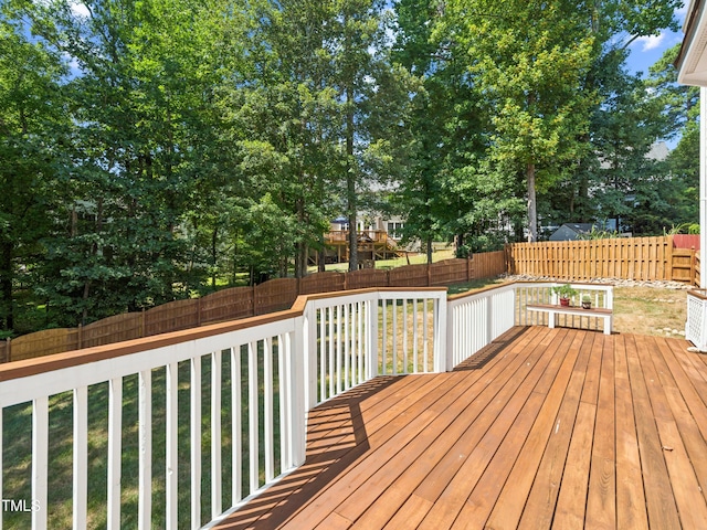 104 Pellinore Ct, Cary, NC 27513 - deck featuring a fenced backyard and view of scattered trees