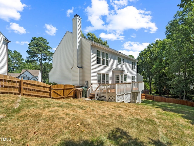 104 Pellinore Ct, Cary, NC 27513 - back of house featuring a deck, a fenced backyard, and a chimney