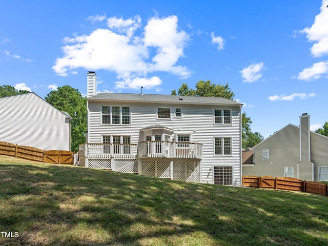 104 Pellinore Ct, Cary, NC 27513 - back of house featuring a wooden deck, a fenced backyard, and a chimney
