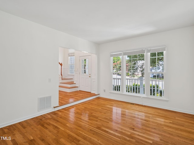 104 Pellinore Ct, Cary, NC 27513 - unfurnished room with light wood-type flooring and stairs