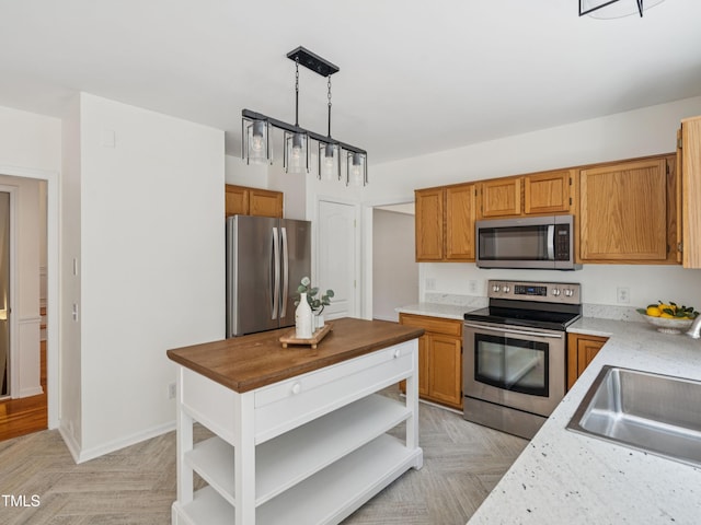104 Pellinore Ct, Cary, NC 27513 - kitchen with stainless steel appliances, open shelves, hanging light fixtures, brown cabinets, and butcher block counters