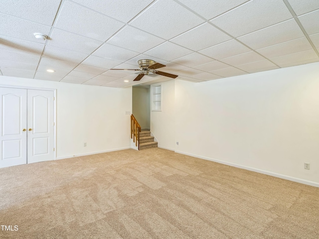 104 Pellinore Ct, Cary, NC 27513 - basement featuring light colored carpet, stairway, a drop ceiling, and recessed lighting