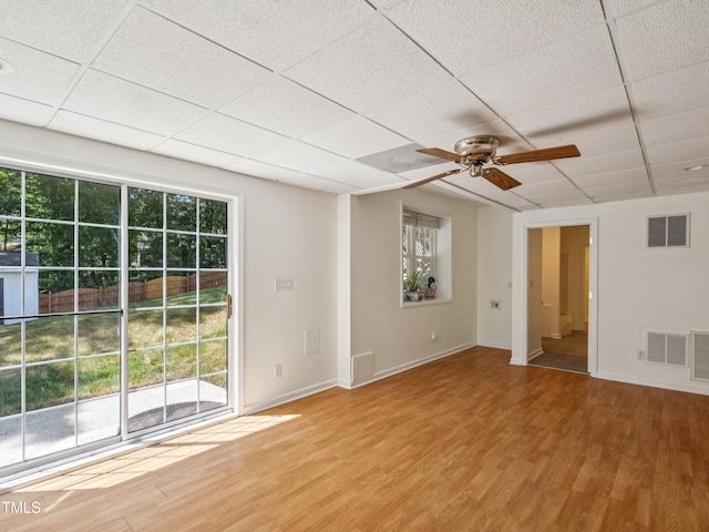 104 Pellinore Ct, Cary, NC 27513 - unfurnished room featuring plenty of natural light, a paneled ceiling, wood finished floors, and a ceiling fan