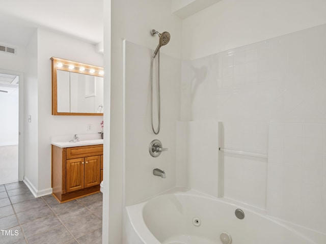 104 Pellinore Ct, Cary, NC 27513 - bathroom featuring vanity, a combined bath / shower with jetted tub, and tile patterned floors