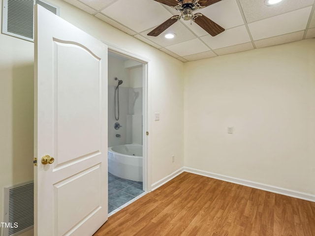 104 Pellinore Ct, Cary, NC 27513 - unfurnished bedroom with light wood-style floors, a paneled ceiling, ensuite bathroom, ceiling fan, and recessed lighting