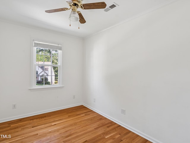 104 Pellinore Ct, Cary, NC 27513 - unfurnished room with crown molding, light wood-type flooring, and a ceiling fan