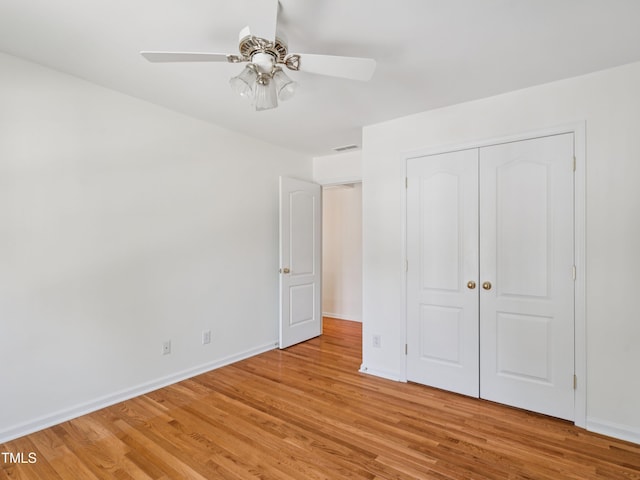 104 Pellinore Ct, Cary, NC 27513 - unfurnished bedroom with light wood finished floors, a closet, and a ceiling fan