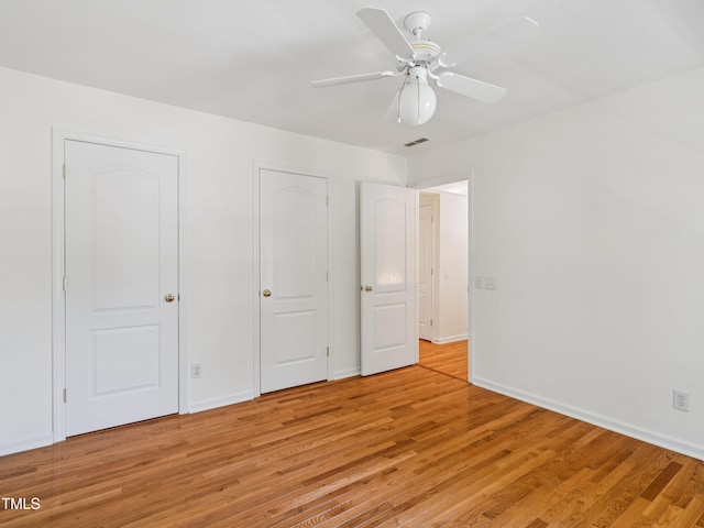 104 Pellinore Ct, Cary, NC 27513 - unfurnished bedroom featuring light wood finished floors and ceiling fan