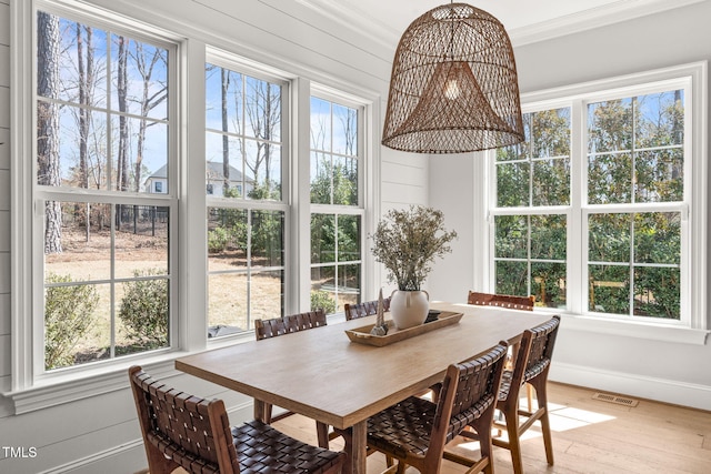 2105 Gardenbrook Dr, Raleigh, NC 27606 - dining space with light wood-style floors and crown molding