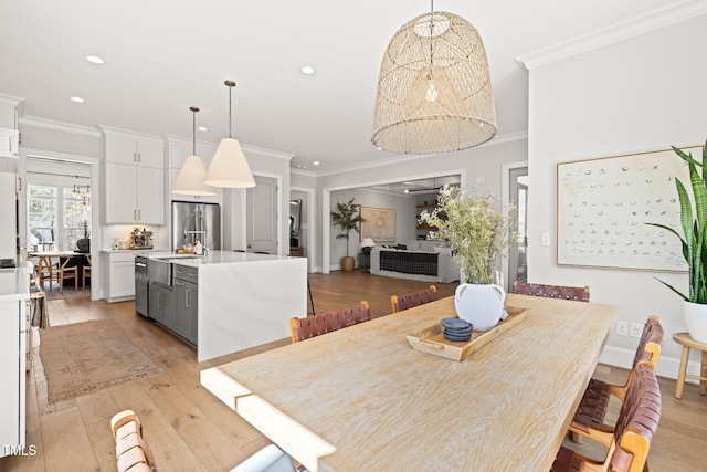 2105 Gardenbrook Dr, Raleigh, NC 27606 - dining area featuring crown molding, recessed lighting, and light wood-style flooring
