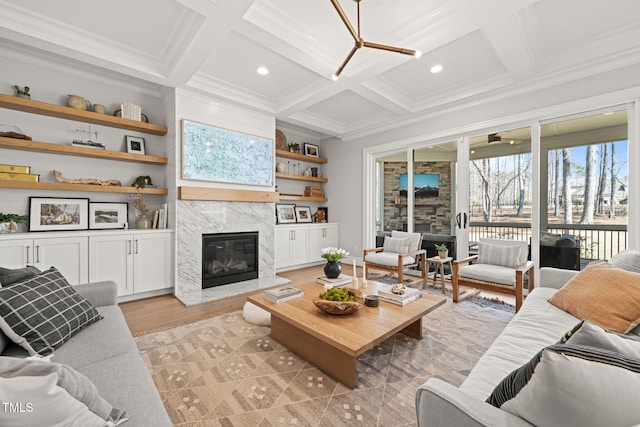 2105 Gardenbrook Dr, Raleigh, NC 27606 - living room featuring a high end fireplace, ornamental molding, coffered ceiling, light wood finished floors, and beam ceiling