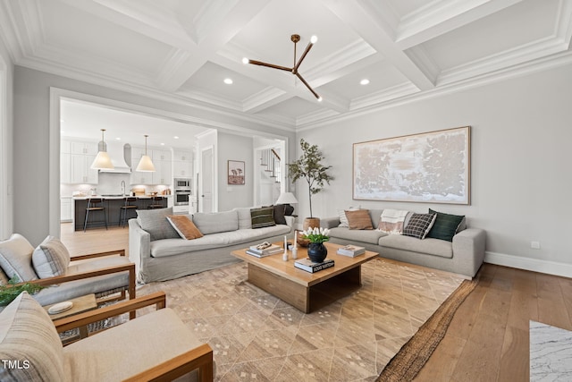 2105 Gardenbrook Dr, Raleigh, NC 27606 - living room featuring coffered ceiling, beamed ceiling, light wood finished floors, ornamental molding, and stairway