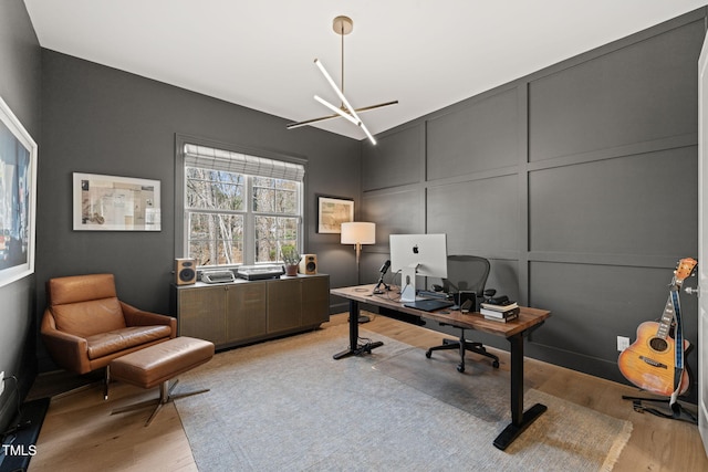 2105 Gardenbrook Dr, Raleigh, NC 27606 - home office with a decorative wall and light wood-type flooring